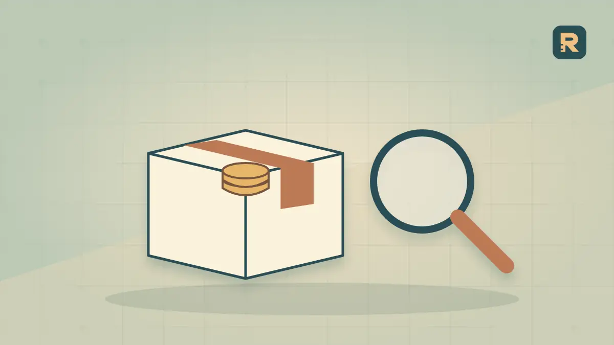 A deep paper archive drawer holds a difficult-to-reach coin while a magnifying tool rests beside it.